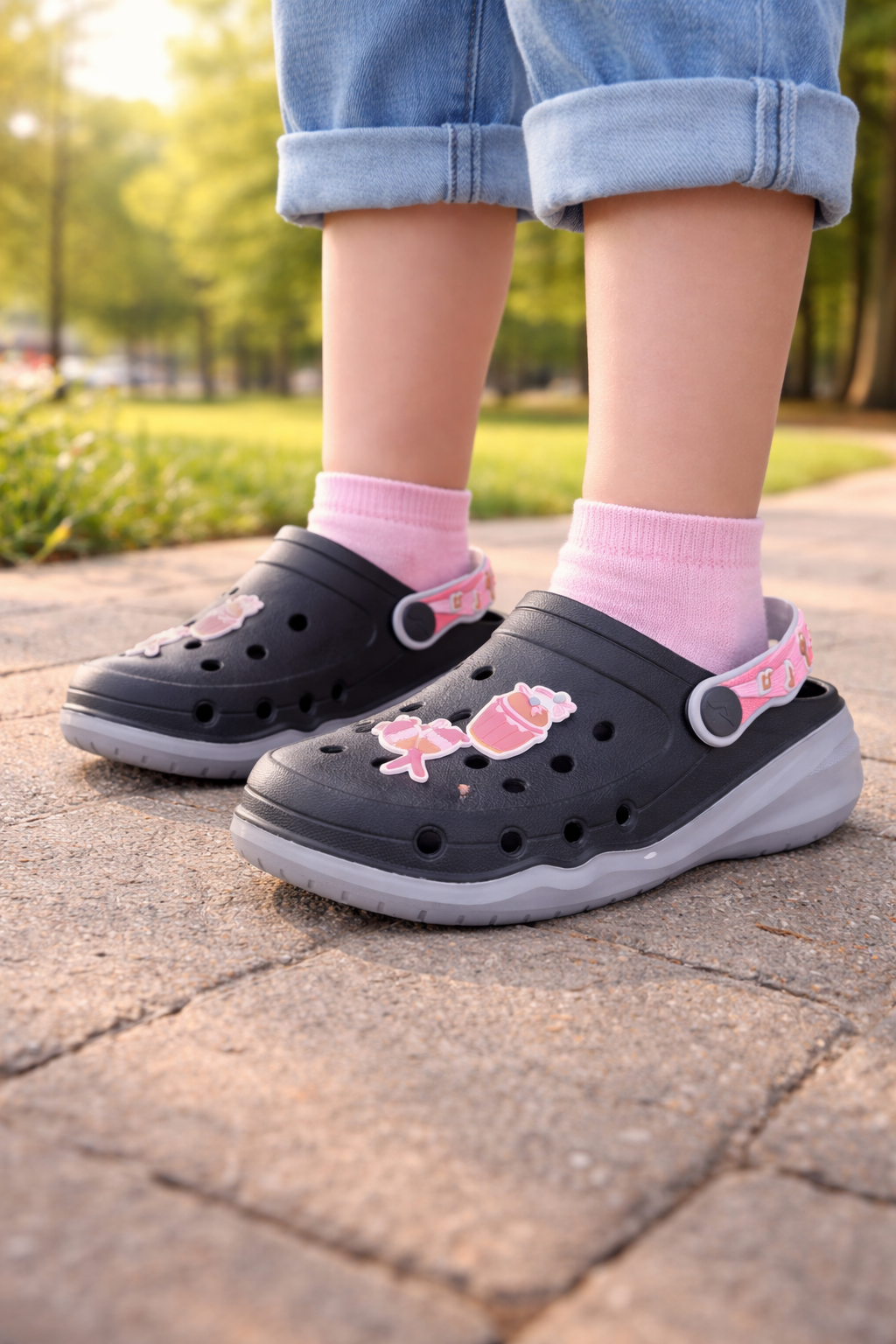 Girls Stylish Black Garden Clogs with Pink Strap and Fun Charm Decorations