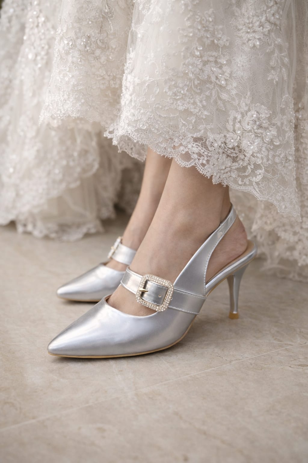 women’s gold and silver pointed-toe heels