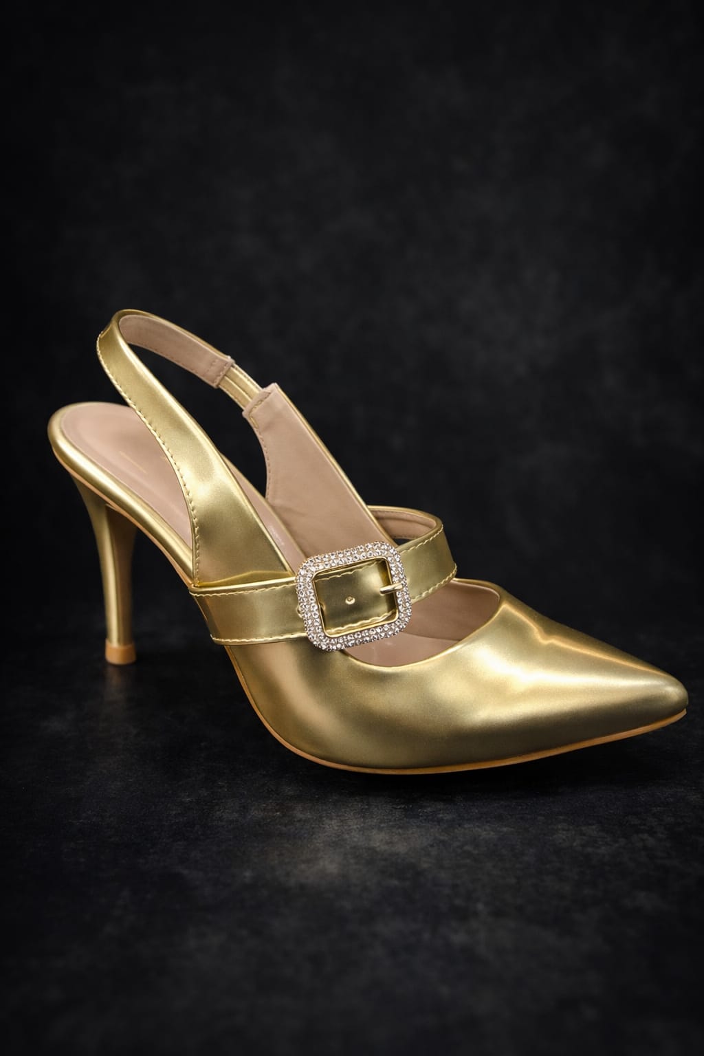 women’s gold and silver pointed-toe heels